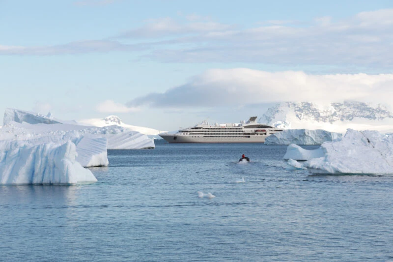 Le-Lyrial-expedition-cruise-ship-in-Antarctica-between-icebergs