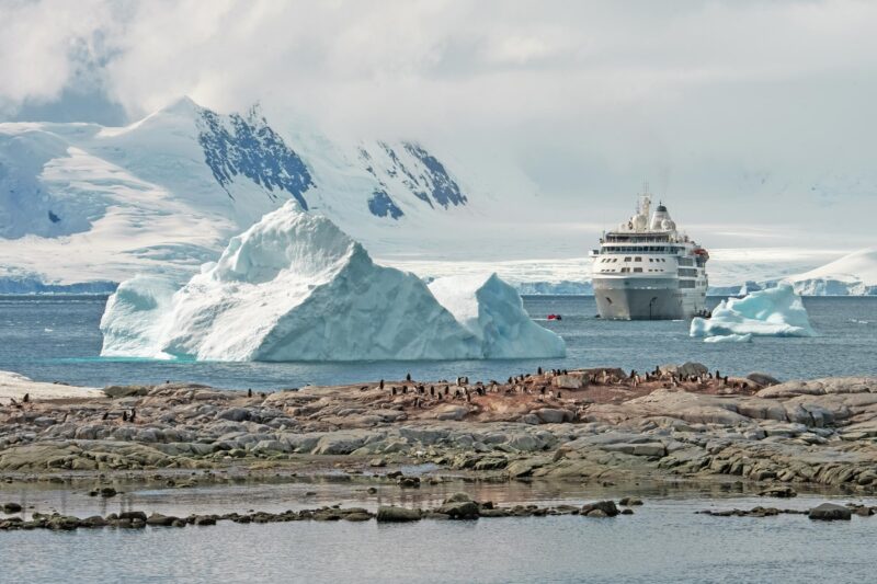 Silver Wind expedition cruise ship in Antarctica with icebergs