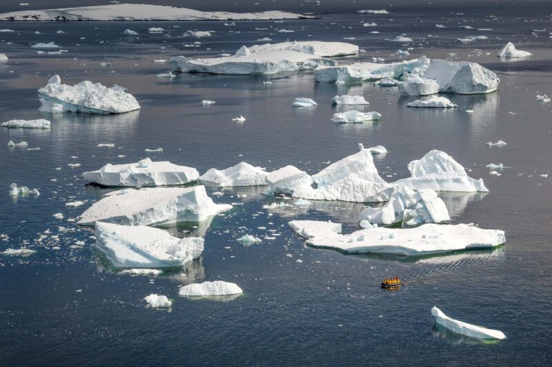 Zodiac cruise in between icebergs in Antarctica