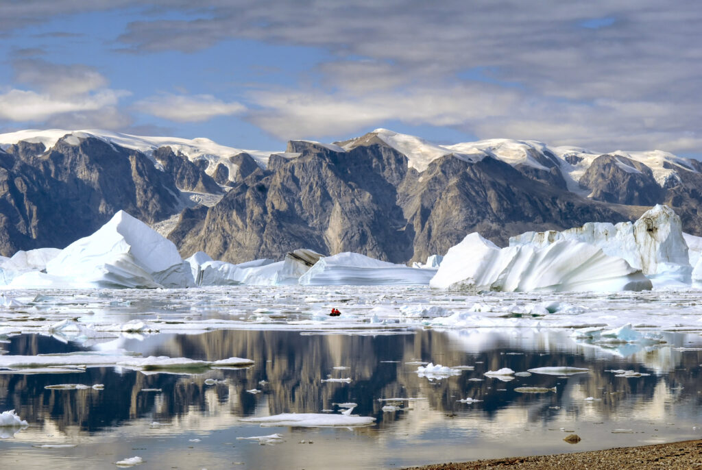 coast mountains and icebergs of East Greenland